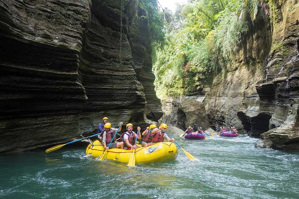 Rafters paddle through  the upper Navua River Gorge on Viti Levu Island in Fiji