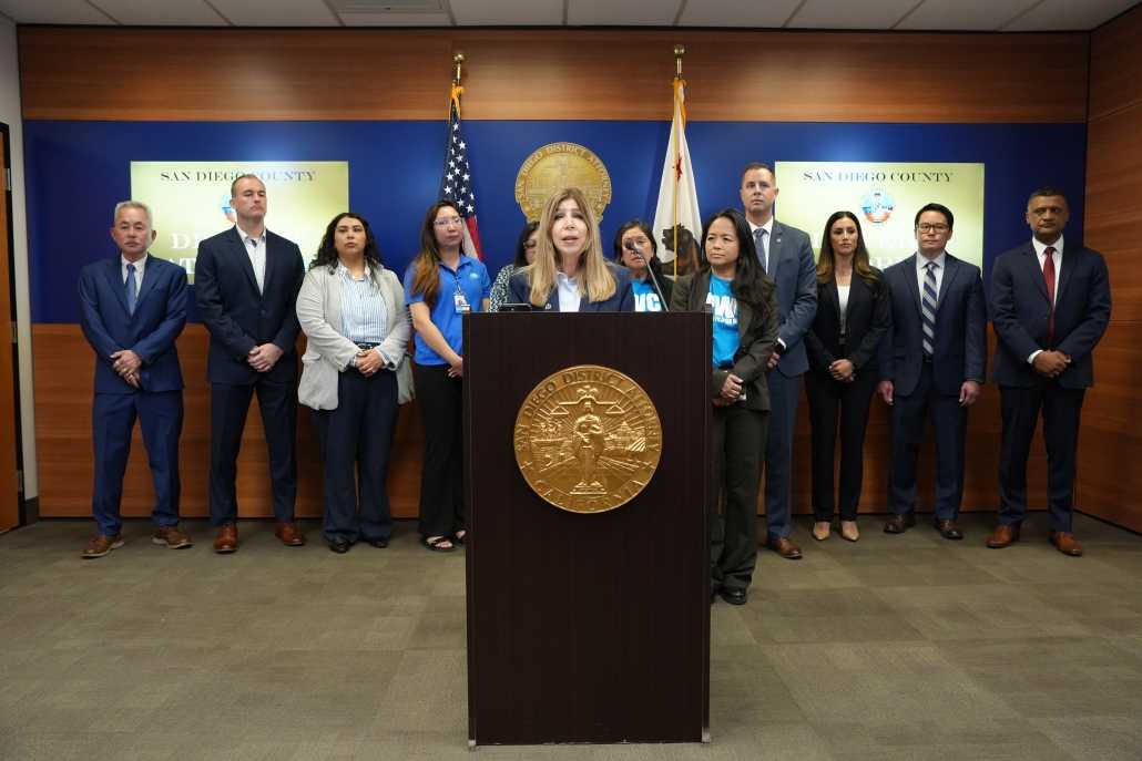 Photo of DA Summer Stephan at press conference announcing human trafficking and wage theft charges today against two defendants who were taking advantage of the immigration status of their workers, forcing them to work around the clock without the pay required under California laws.