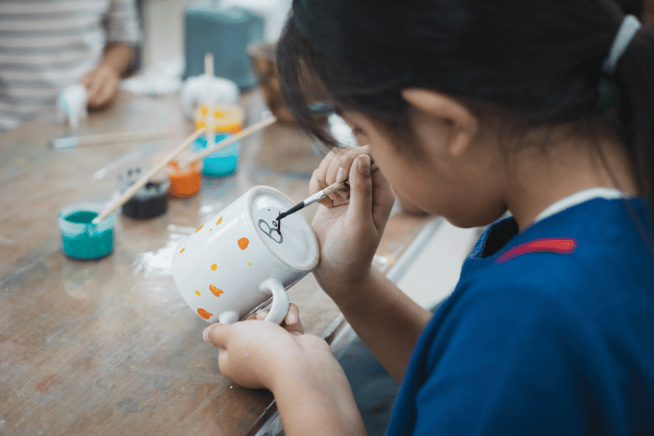 Get creative with a personalized coffee mug painting activity.