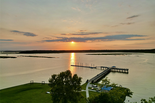 Golden hour over the pier, a serene Lowcountry sunset worth pausing for.