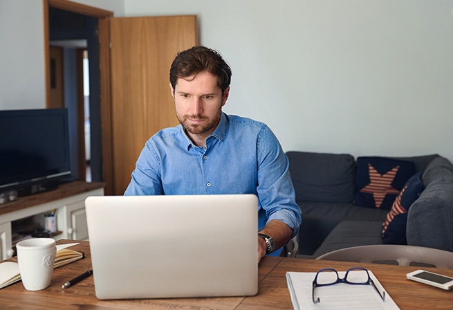 woman sitting at home on laptop