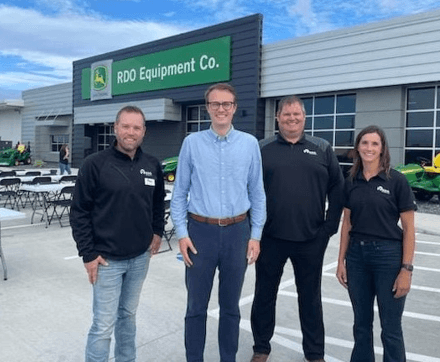 A photo of Senator Rasmusson and RDO Equipment Co. employees standing in front of the new RDO location in Fergus Falls.