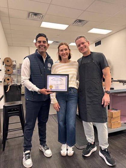 Democratic Leader Ranjeev Puri presenting a Business of the Month certificate to Elizabeth and Brandon Mitchell. Democratic Leader Ranjeev Puri presenting a Business of the Month certificate to Elizabeth and Brandon Mitchell.
