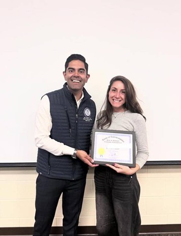 Democratic Leader Ranjeev Puri presenting a Teacher of the Month certificate to Olivia Foster. Democratic Leader Ranjeev Puri presenting a Teacher of the Month certificate to Olivia Foster.