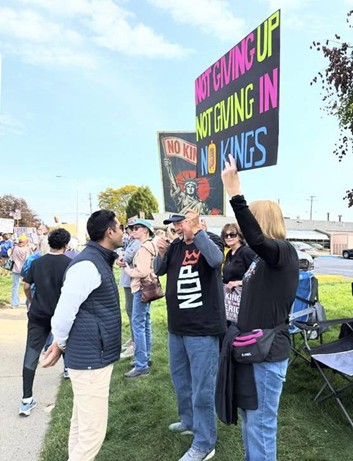 Democratic Leader Ranjeev Puri speaking with protesters holding signs that read "Not Giving Up, Not Giving In, No Kings." Democratic Leader Ranjeev Puri speaking with protesters holding signs that read "Not Giving Up, Not Giving In, No Kings."