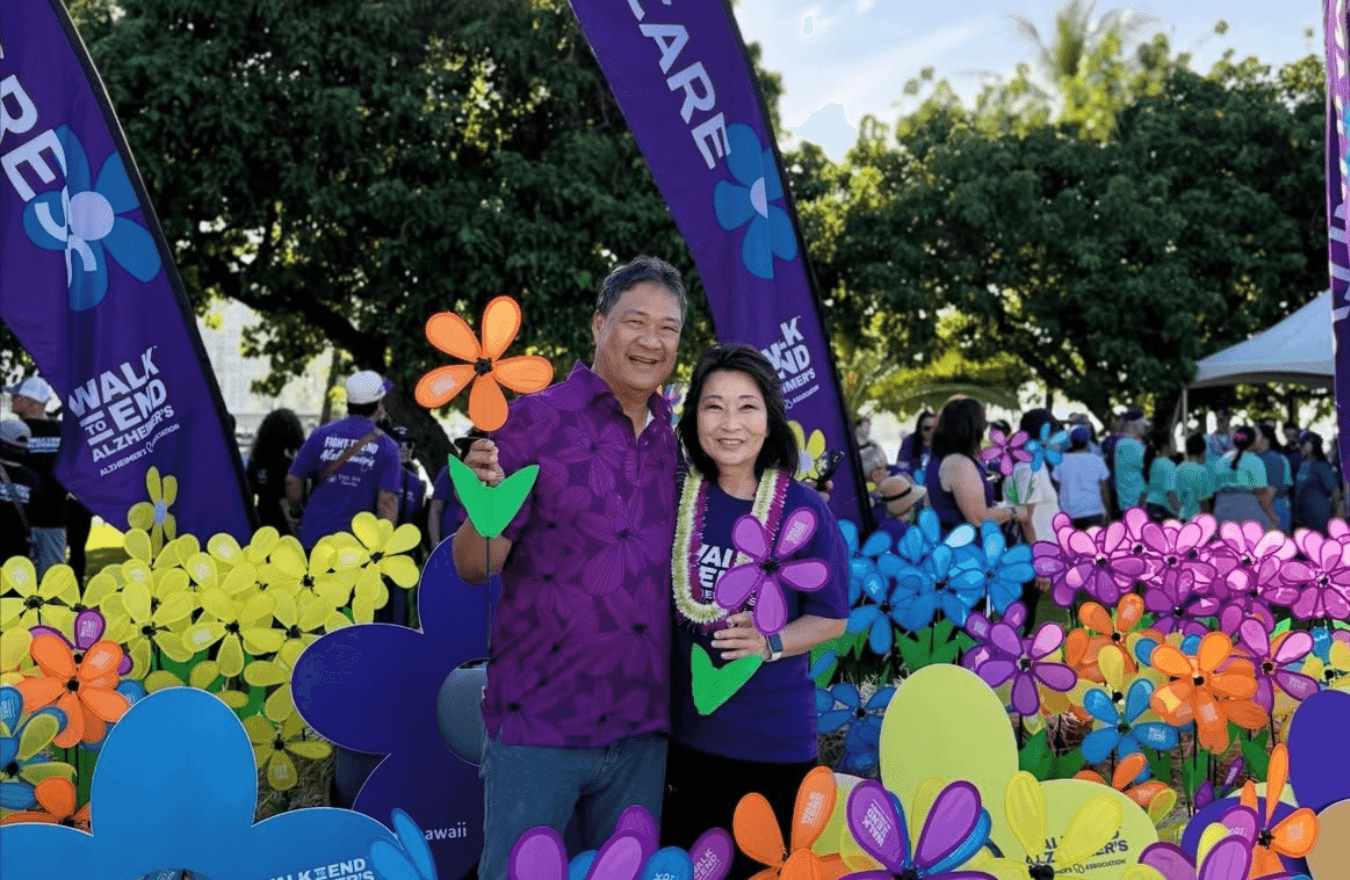 Lt. Gov. Sylvia Luke and a man smiling for a picture outside. 