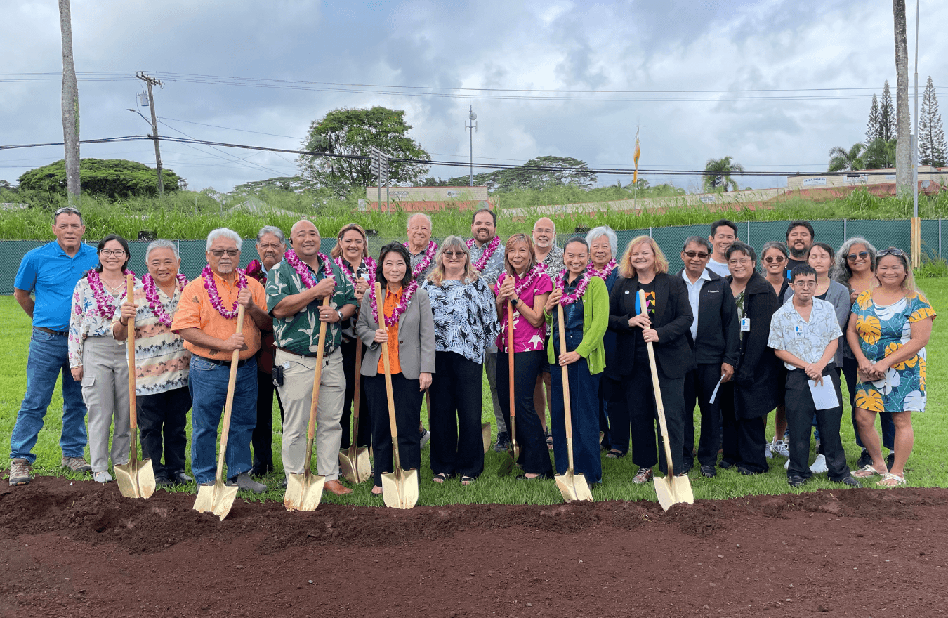 Lt. Gov. Sylvia Luke, legislators, and community members holding shovels next to a pile of dirt. 
