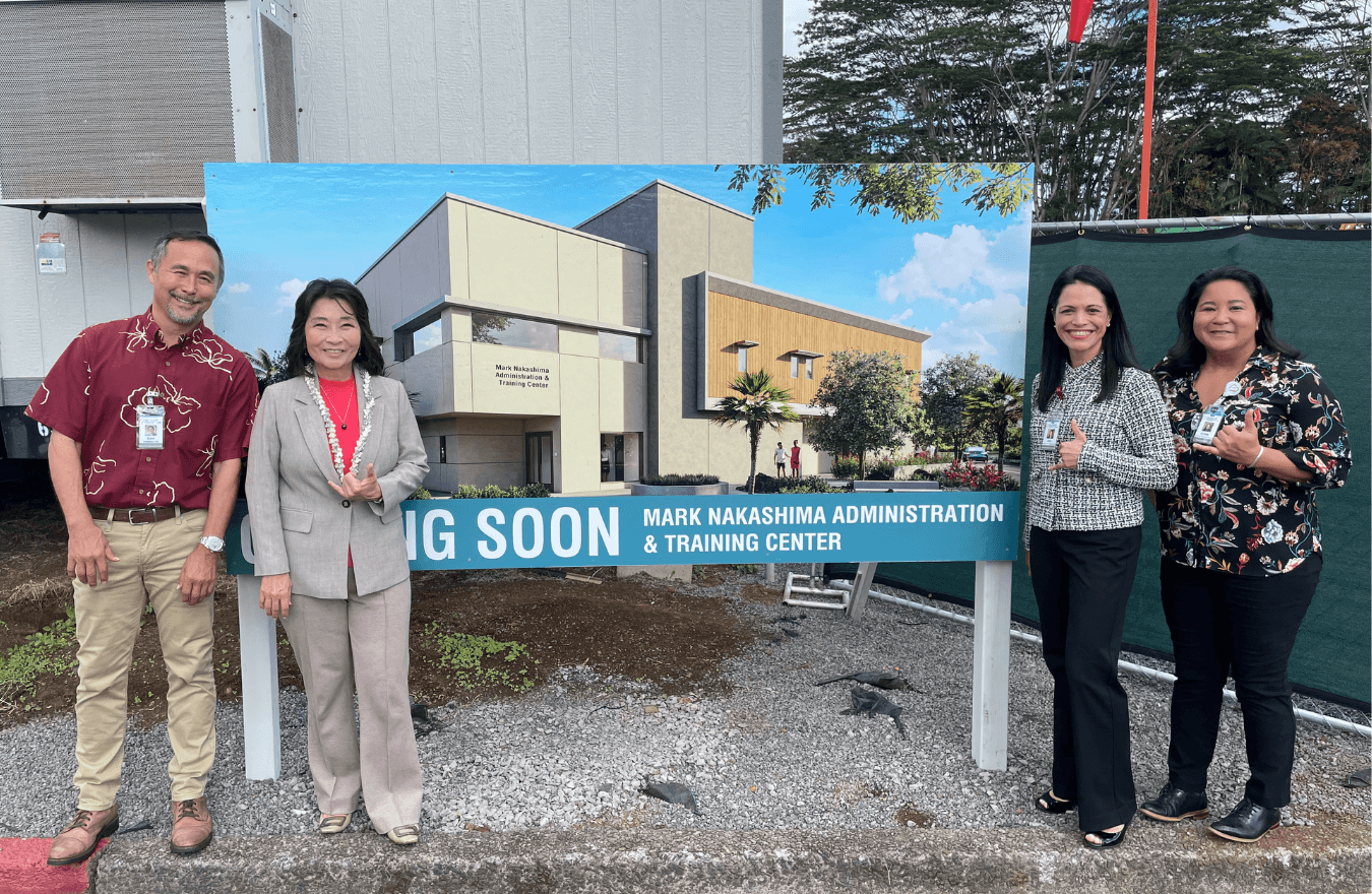 Lt. Gov. Sylvia Luke and community leaders standing in front of a sign reading Mark Nakashima Administration & Training Center. 