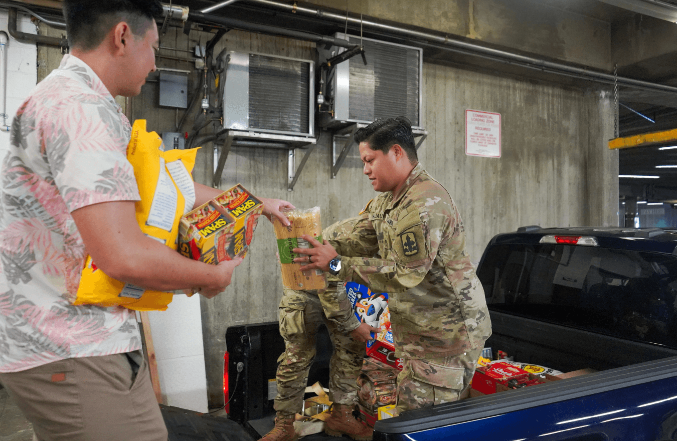 National Guard member handling food donations. 