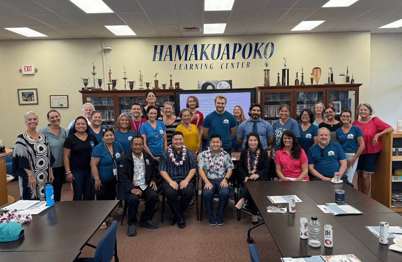 Lt. Gov. Sylvia Luke with legislators and community leaders smiling for a group picture. 