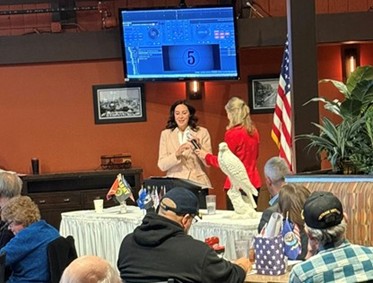 Michigan state Representative Angela Witwer speaking at the Delta Waverly Rotary Club Veterans Day Brunch Event. Michigan state Representative Angela Witwer speaking at the Delta Waverly Rotary Club Veterans Day Brunch Event.