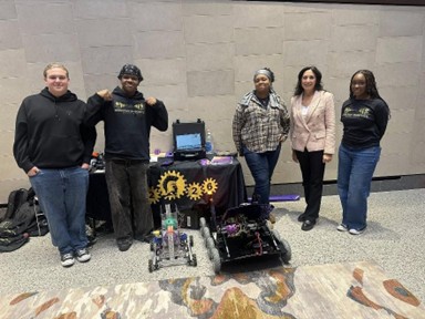 Michigan state Representative Angela Witwer with students next to their robots at the Student Technology Showcase in the Michigan Capitol Building. Michigan state Representative Angela Witwer with students next to their robots at the Student Technology Showcase in the Michigan Capitol Building.