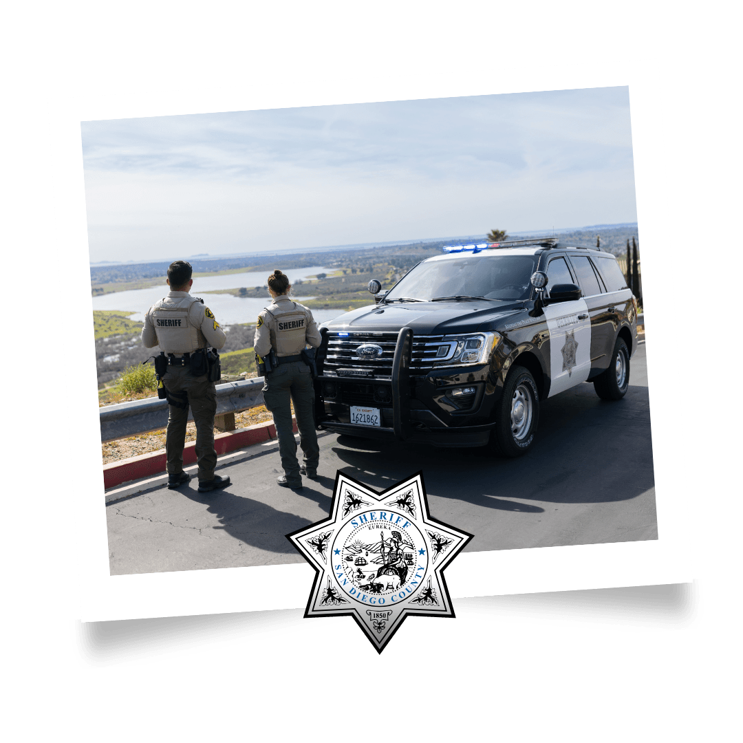 Avoiding Fraud Scams man working on his desk with a black tie and alot of paper around him.