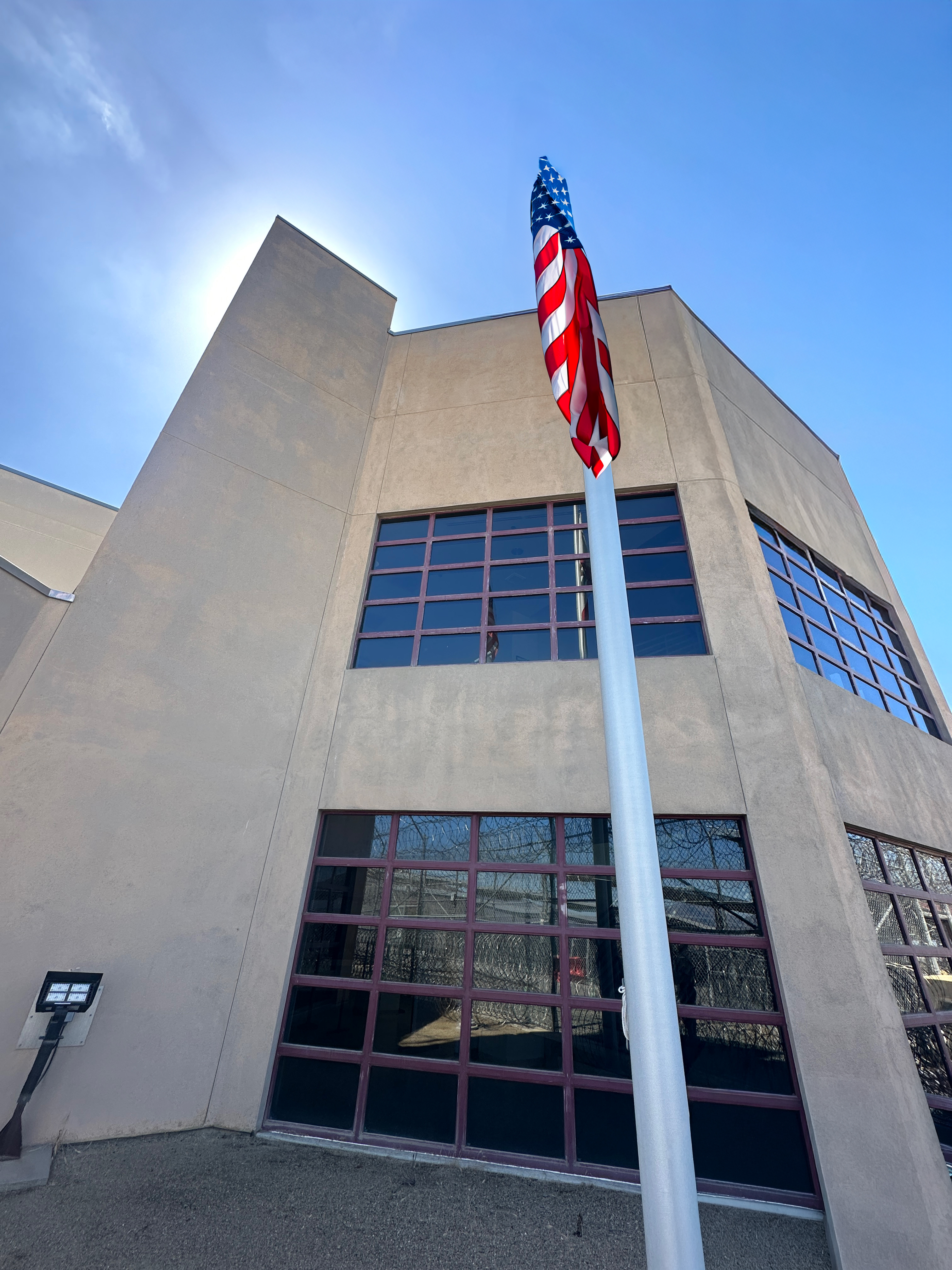 Yana program photo with two deputies and Sheriff Senior Patrol with a crime prevention specialist inside someone's home with an elderly women holding a pie.
