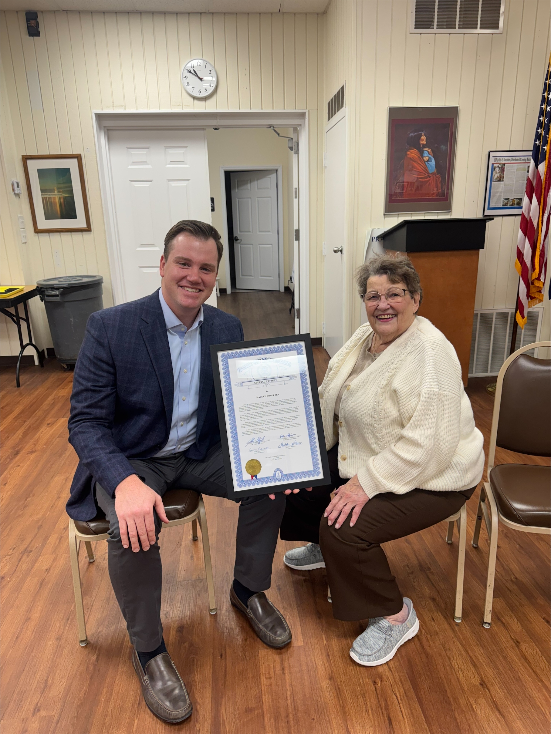 State Rep. John Fitzgerald presenting a framed certificate to the business owner of Marge's Donut Den in Wyoming. State Rep. John Fitzgerald presenting a framed certificate to the business owner of Marge's Donut Den in Wyoming.