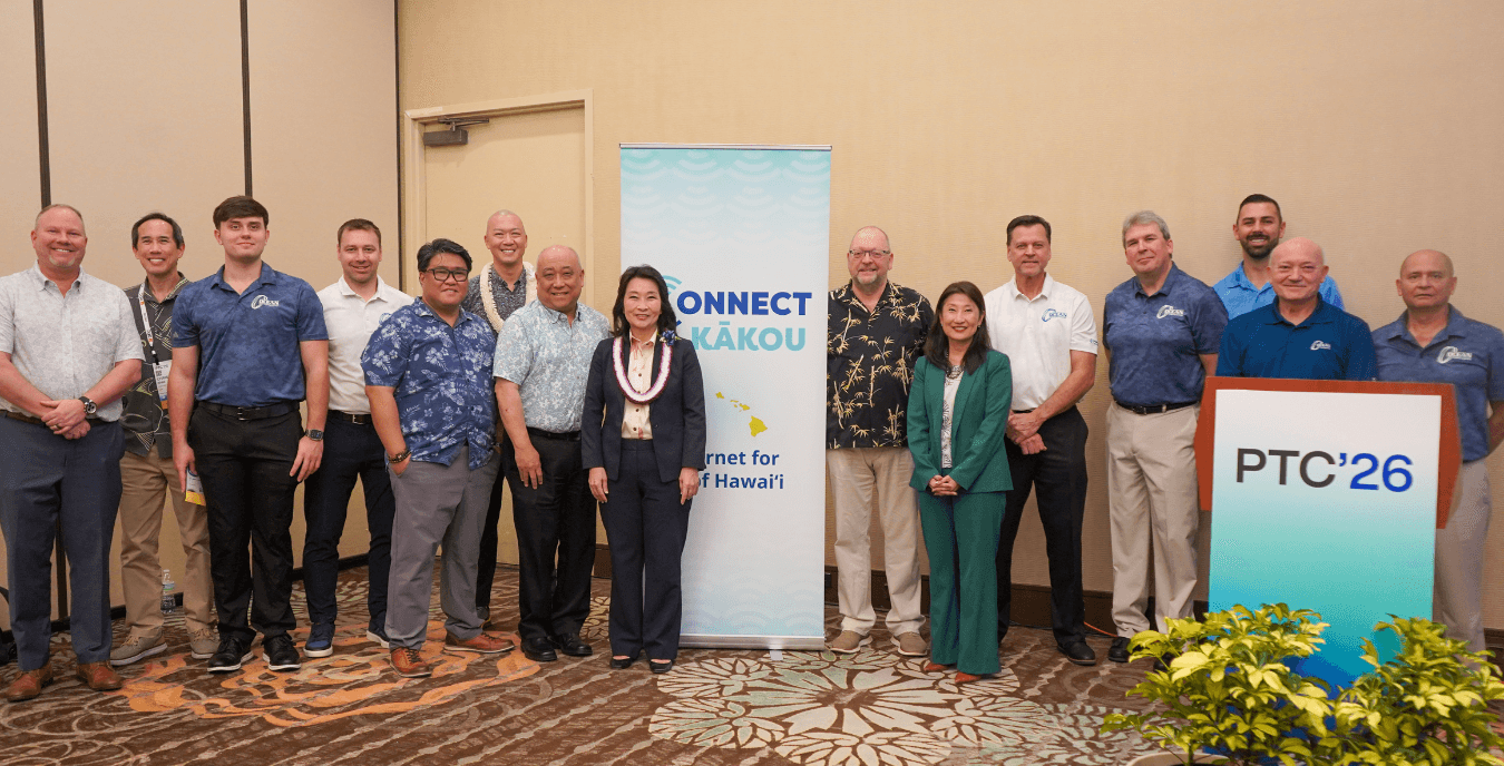 Lt. Gov. Sylvia Luke and group of digital infrastructure and tech leaders smiling for a group photo.