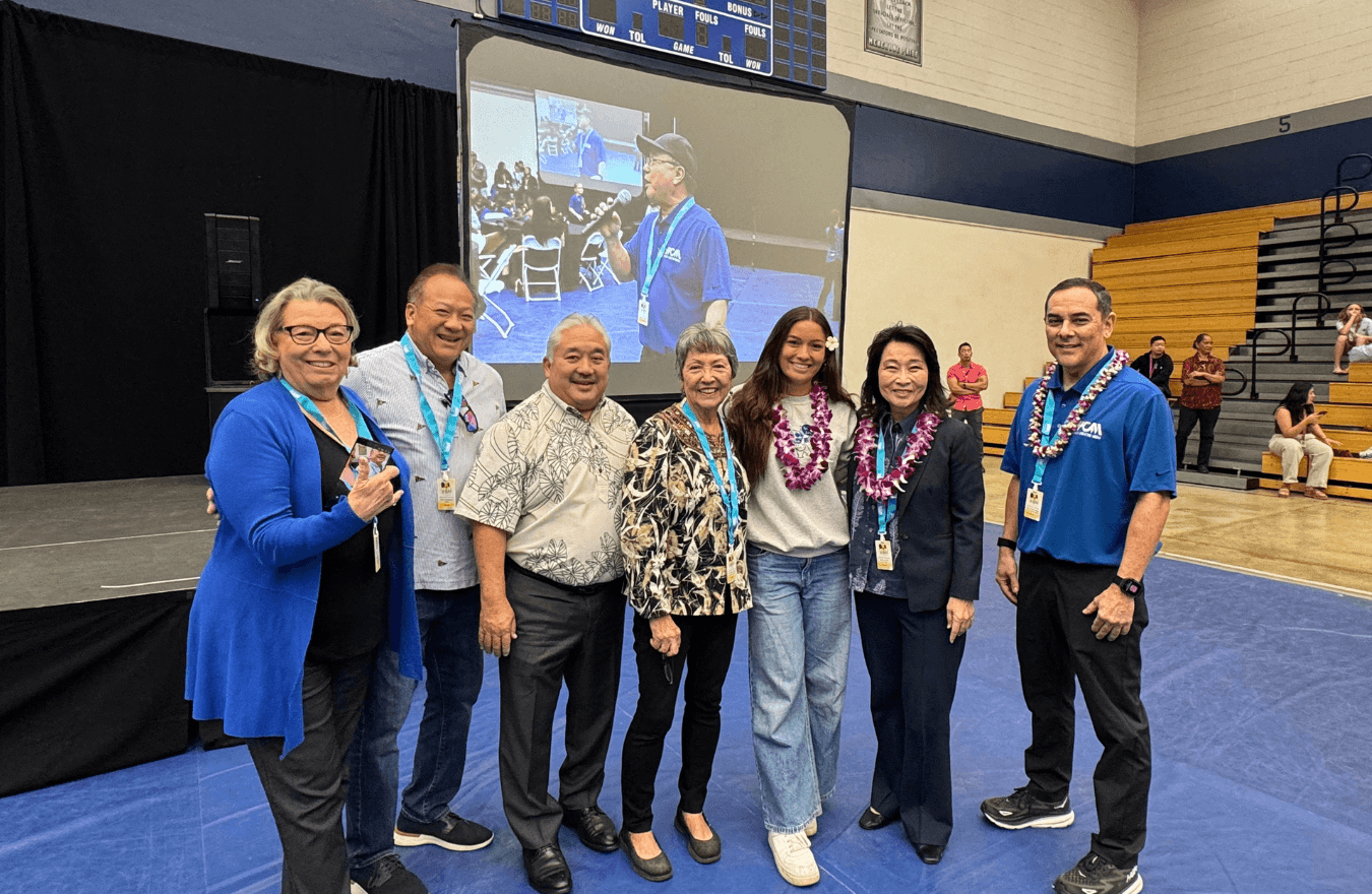 Lt. Gov. Sylvia Luke, a legislator, and group smiling for a group photo. 