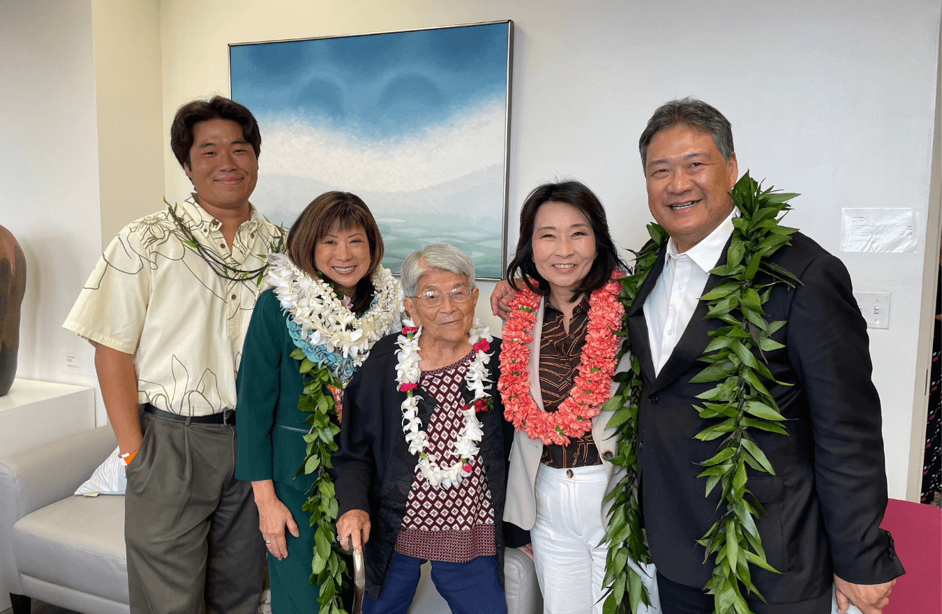 Lt. Gov. Sylvia Luke, a legislator, and group smiling for a group photo.