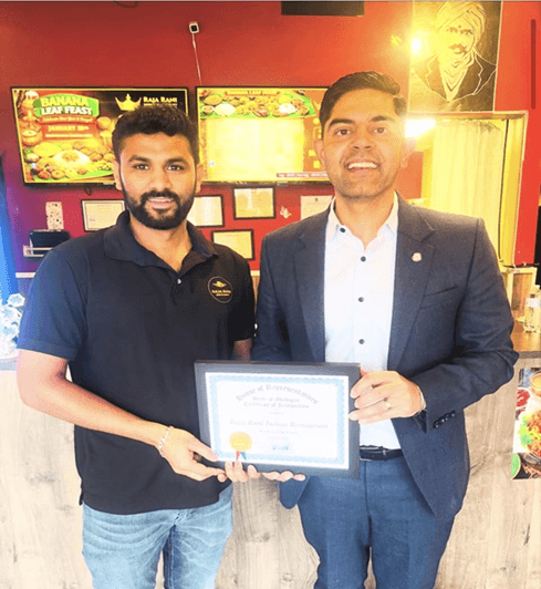 Democratic Leader Ranjeev Puri presenting a tribute to the owner of Raja Rani. Democratic Leader Ranjeev Puri presenting a tribute to the owner of Raja Rani.