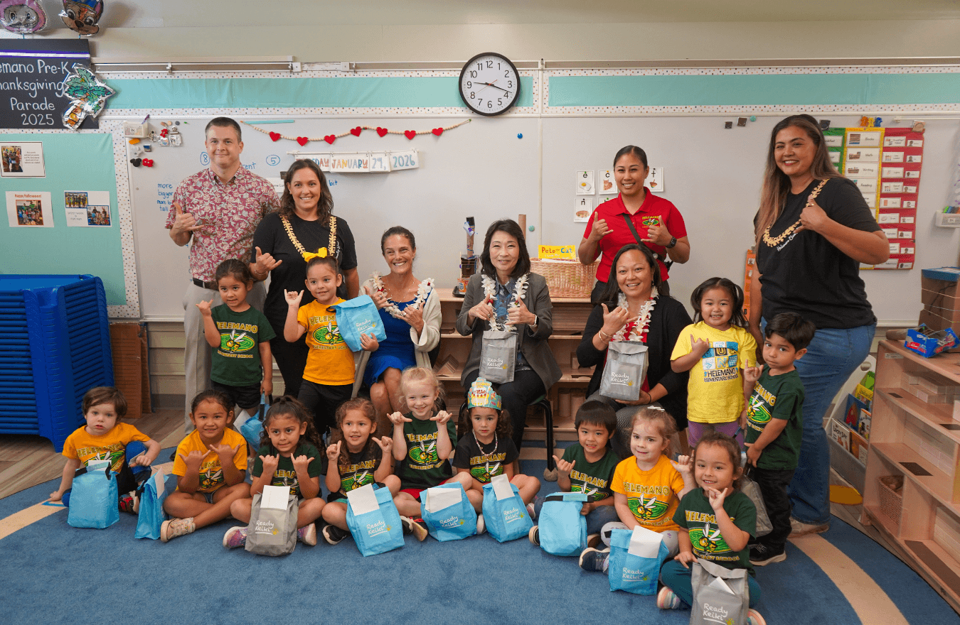 Lt. Gov. Sylvia Luke, a legislator, teachers, and pre-k students smiling and holding up shakas in a Ready Keiki preschool classroom in Wahiawā, Oʻahu. 