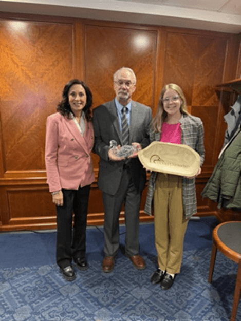 Michigan State Representative Angela Witwer and her Legislative Director Jocelyn Bundy holding an award from Michigan Ducks Unlimited. Michigan State Representative Angela Witwer and her Legislative Director Jocelyn Bundy holding an award from Michigan Ducks Unlimited.