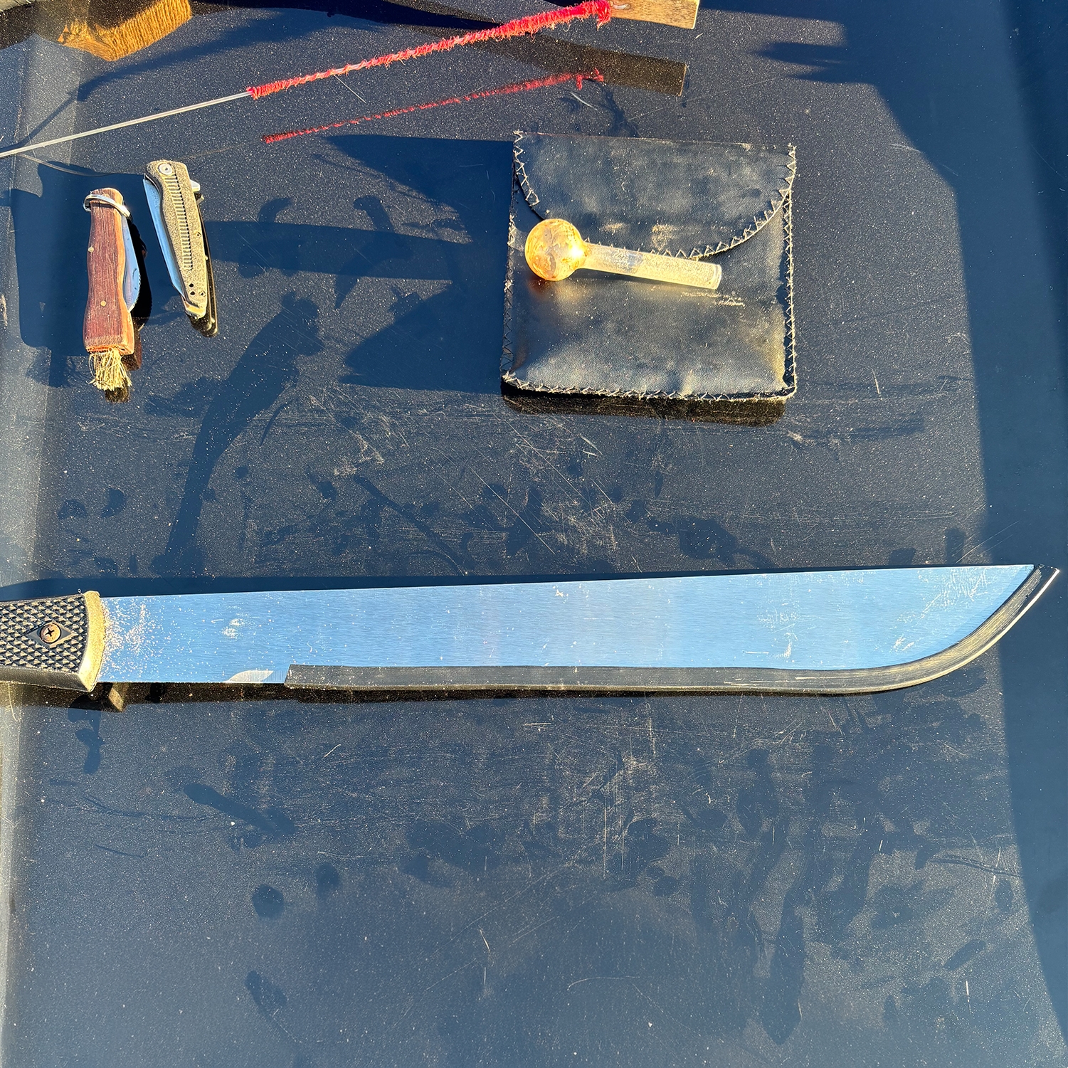 Yana program photo with two deputies and Sheriff Senior Patrol with a crime prevention specialist inside someone's home with an elderly women holding a pie.