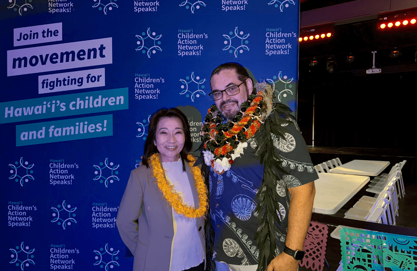 Lt. Gov. Sylvia Luke and a man wearing lei while smiling for a photo. 