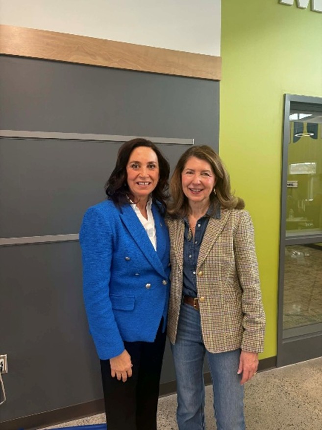 Michigan state Representative Angela Witwer with a constituent. Michigan state Representative Angela Witwer with a constituent.