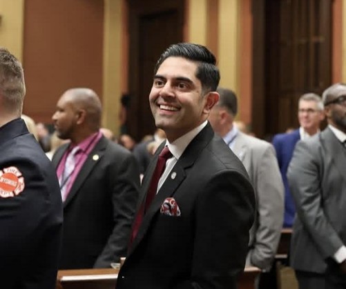 Michigan House Democratic Leader Ranjeev Puri smiling on the House floor in the Michigan Capitol Building. Michigan House Democratic Leader Ranjeev Puri smiling on the House floor in the Michigan Capitol Building.