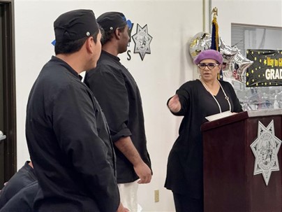Volunteers walking in front of a house.