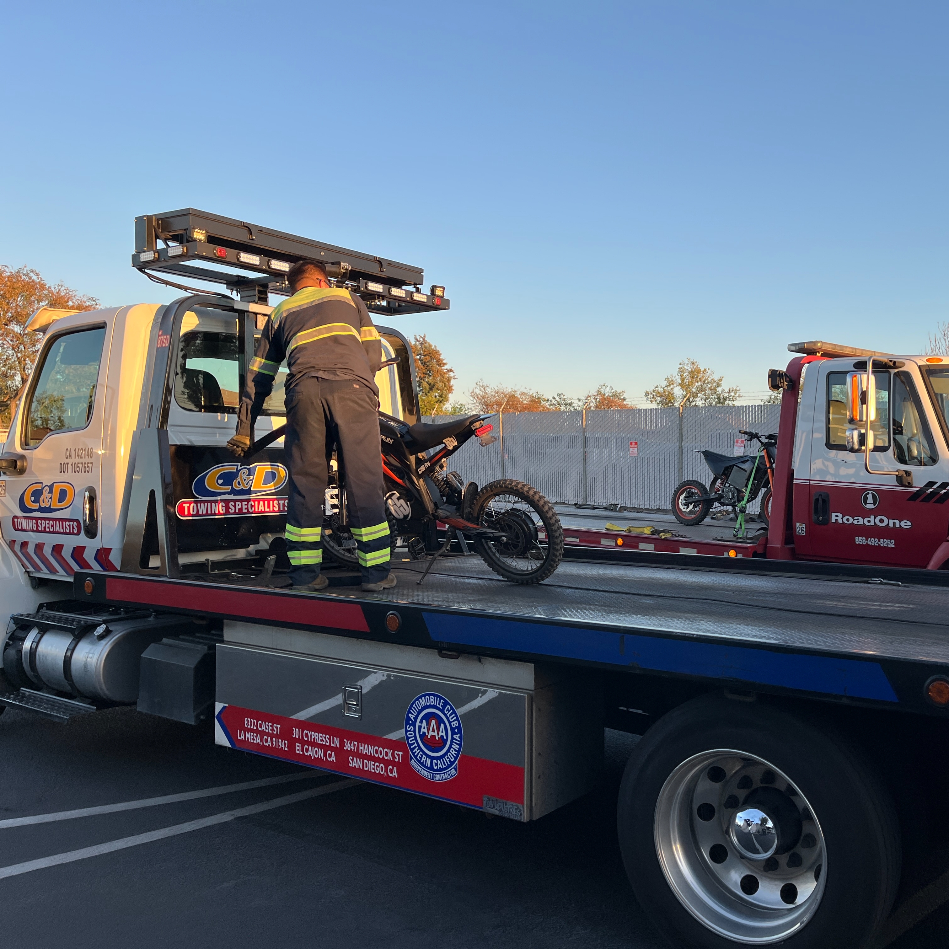 Tow truck with e motorcycle.
