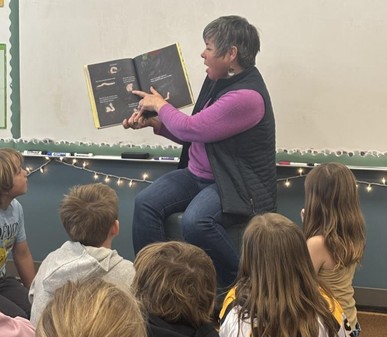 State Representative Betsy Coffia reading to a classroom of elementary school children. State Representative Betsy Coffia reading to a classroom of elementary school children.