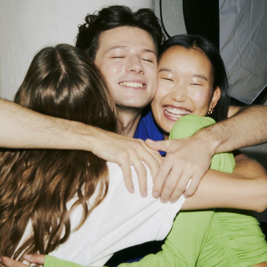 Friends hugging — good things are better shared.