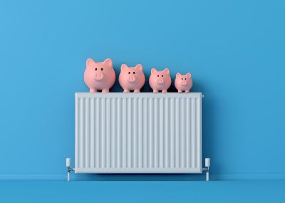 Photo of piggy banks on a household radiator