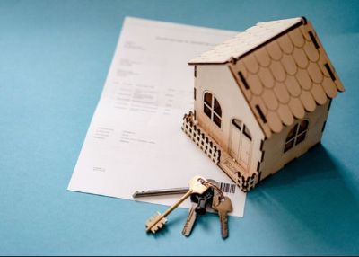 Photo of model house with keys