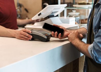 Photo of customer paying at counter