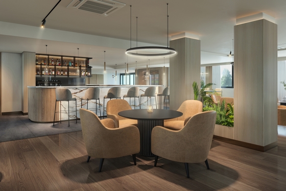 Design-led bar area with round ceiling lights and 4 beige chairs 