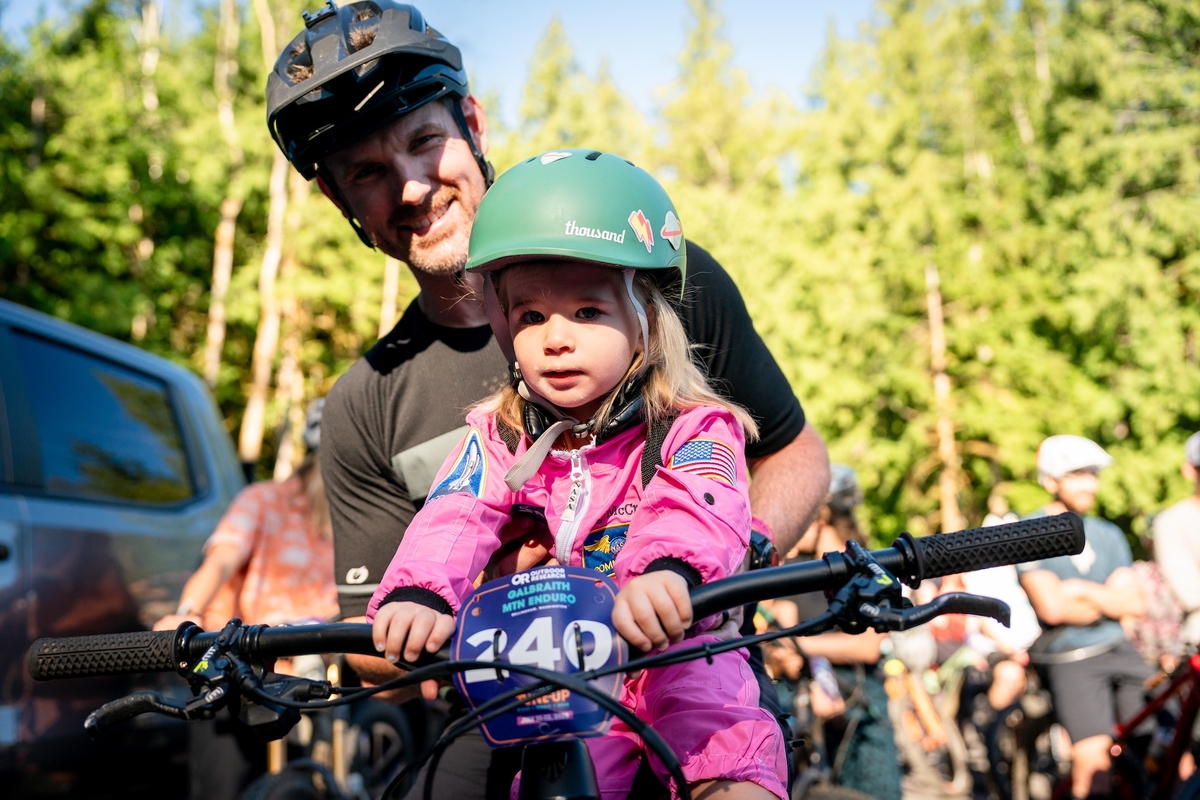 A person holds their phone up during a concert.