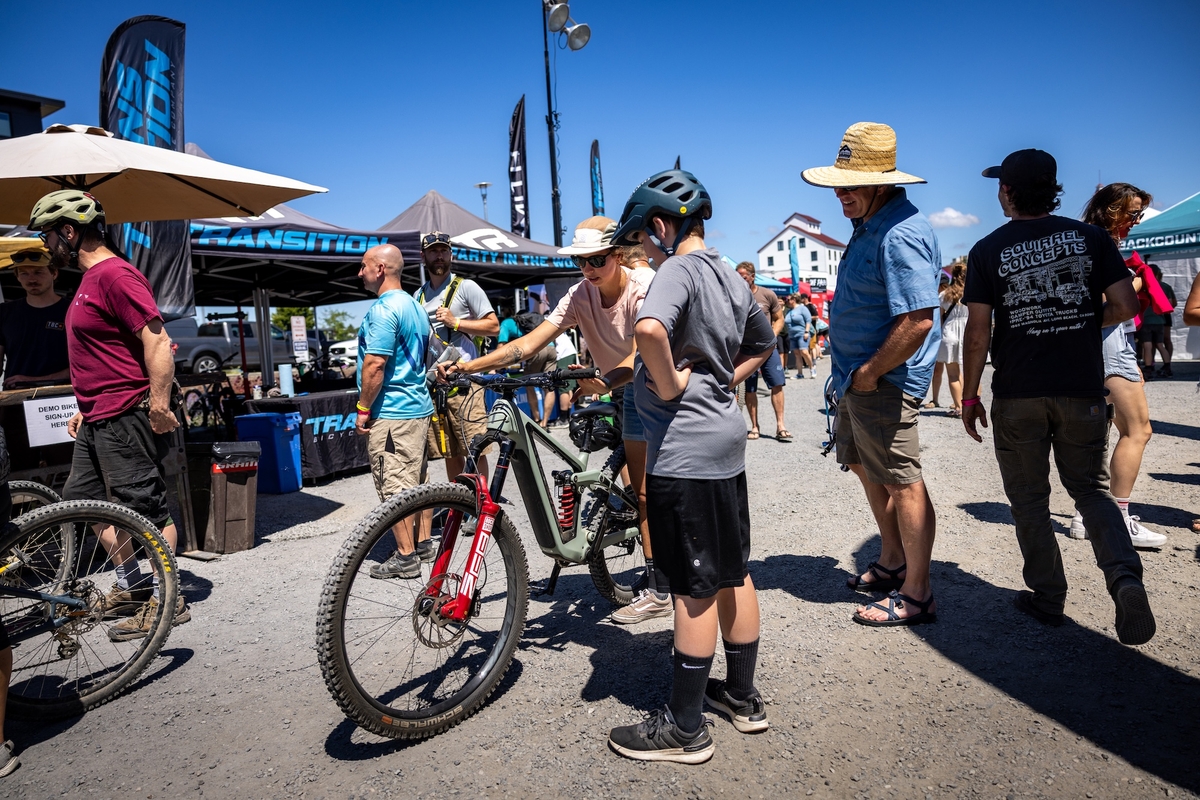 A person holds their phone up during a concert.