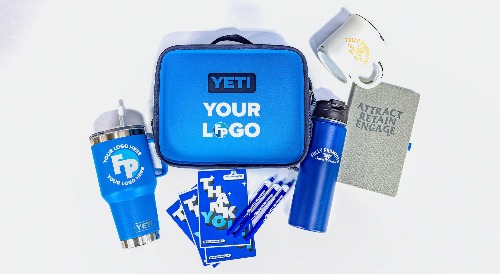 A Fully Promoted Branded gift set containing pens, a reusable water bottle, and a notebook.