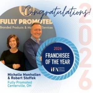 Promotional graphic recognizing Fully Promoted Centerville owners Michelle Monhollen and Robert Steffek as 2026 IFA Franchisees of the Year.