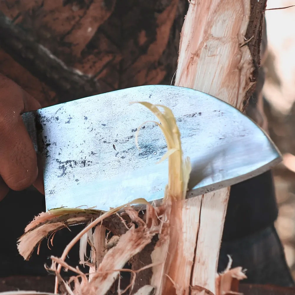 Knife being used for outdoor tasks like cutting rope
