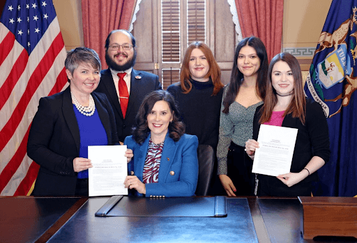 Michigan State Representative Betsy Coffia pictured with her legislative team, Ashleigh, Kate Nieman, and Jade Prange, Heath Lowry, and Governor Gretchen Whitmer, at the bill signing of House Bill 4516. Michigan State Representative Betsy Coffia pictured with her legislative team, Ashleigh, Kate Nieman, and Jade Prange, Heath Lowry, and Governor Gretchen Whitmer, at the bill signing of House Bill 4516.