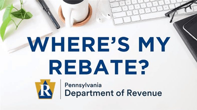 A picture of a desk with a keyboard with text that says "Where's my rebate?"