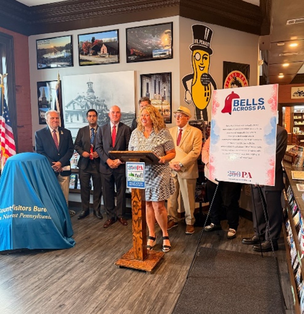 A picture of the unveiling of the America 250 PA Luzerne County bell, with Rep. Pashinski and other officials.