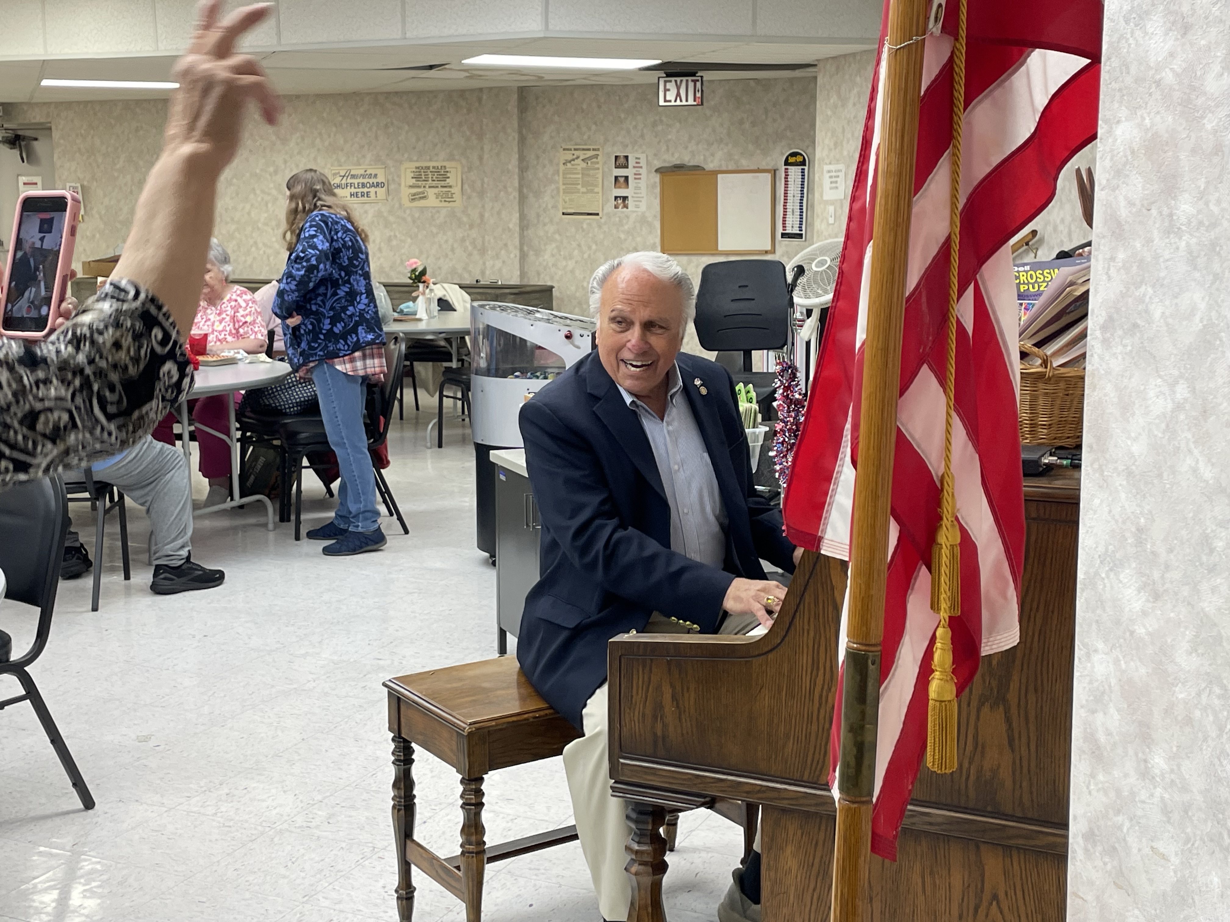 A picture of Rep. Pashinski playing piano at the Senior Center end of Summer Bash.