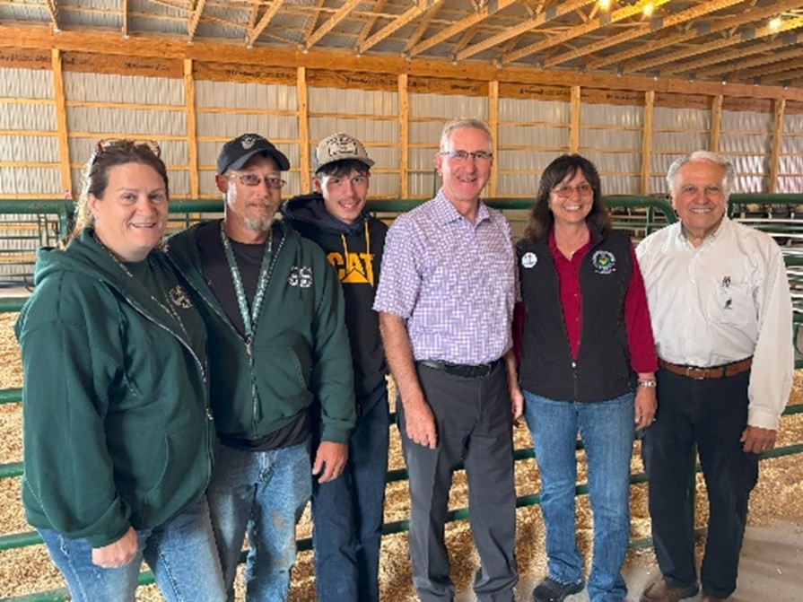 Rep. Pashinski, Sec. Redding, Rep. Brenda Pugh and Fair volunteers and participants pose in the new barn.