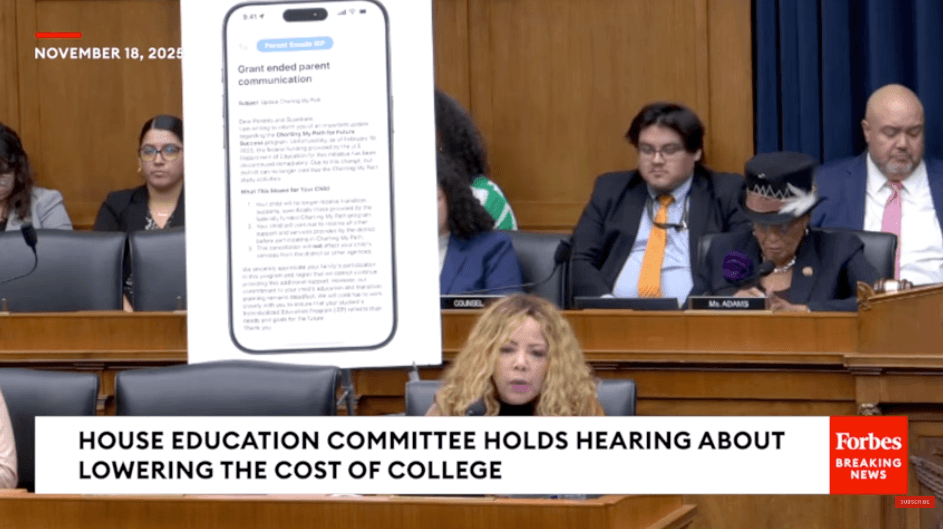 Screenshot of Rep. McBath speaking in committee in Washington, DC. She is sitting behind the dais next to a poster.