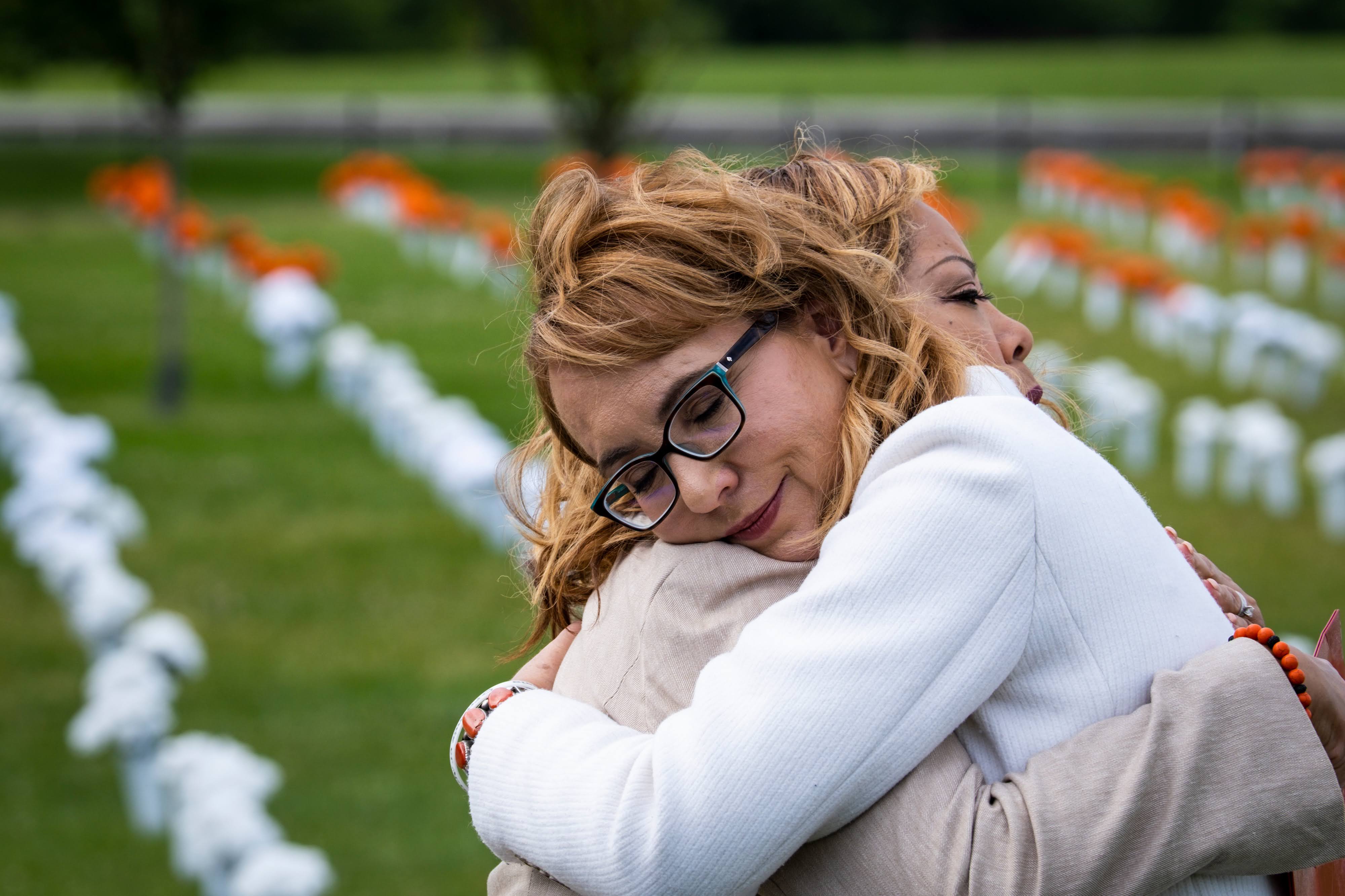 Congresswoman Lucy McBath embraces former Congresswoman Gabby Giffords on the National Mall.