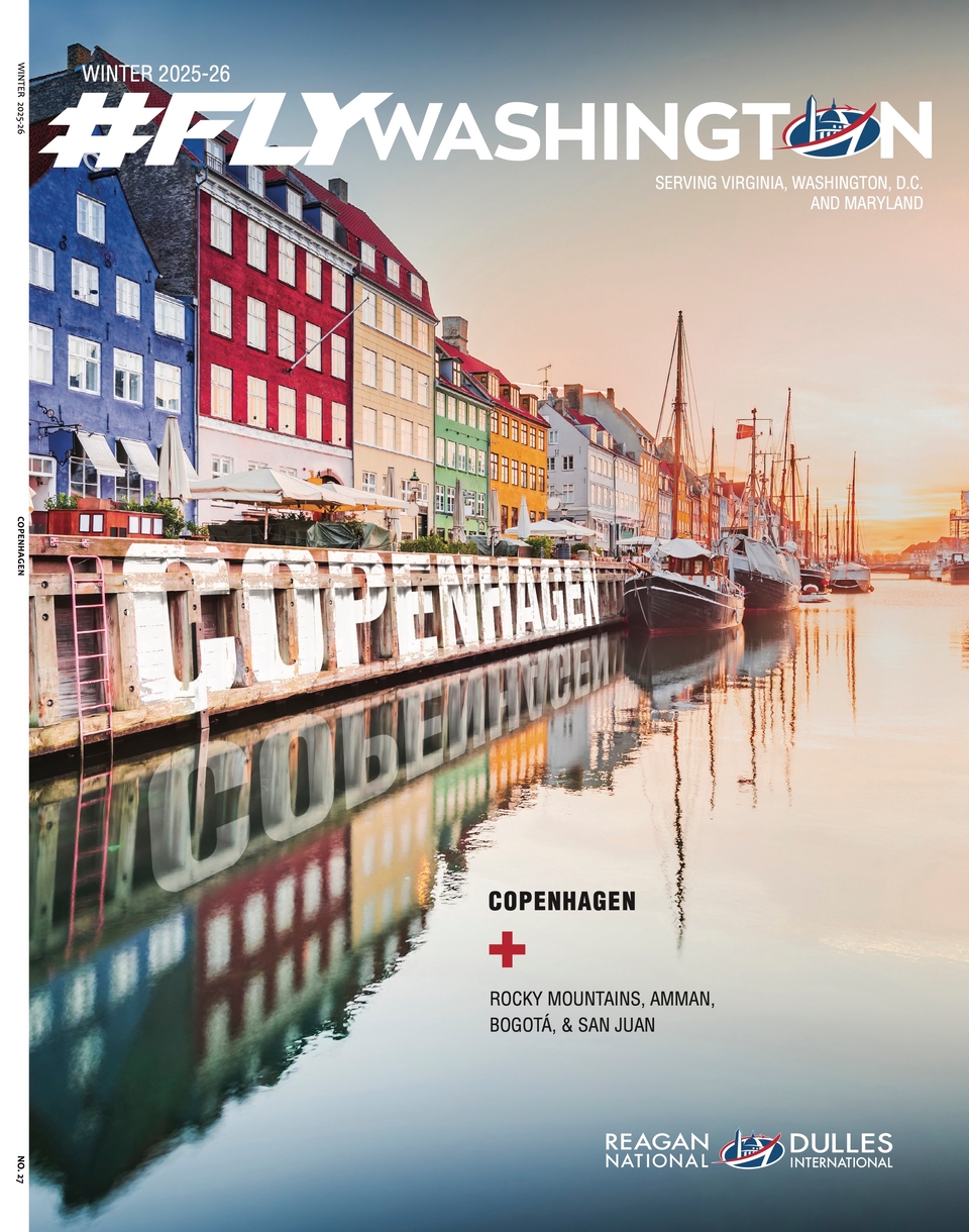 Cover of 'Fly Washington' magazine, Winter 2025-26 issue, featuring a vivid sunset image of the colorful canal-side buildings and boats in Copenhagen. The magazine serves Virginia, Washington, D.C., and is associated with Reagan National and Dulles International airports.